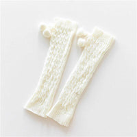 Mandotos knitted wool daytime leggings and knee-high socks, soft and warm for cozy winter wear, shown in natural beige color.