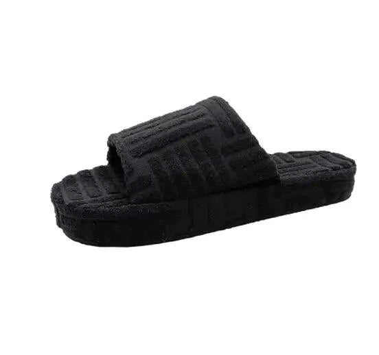 Comfortable ladies' plush slip-on slippers by MANDOTOS with soft, fluffy material and cozy design for indoor wear.