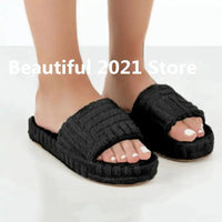 Comfortable ladies' plush slip-on slippers by MANDOTOS with soft, cozy fabric for indoor wear.