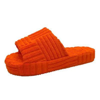 Comfortable ladies' plush slip-on slippers by MANDOTOS with soft, cozy fabric and slip-on design perfect for indoor wear.