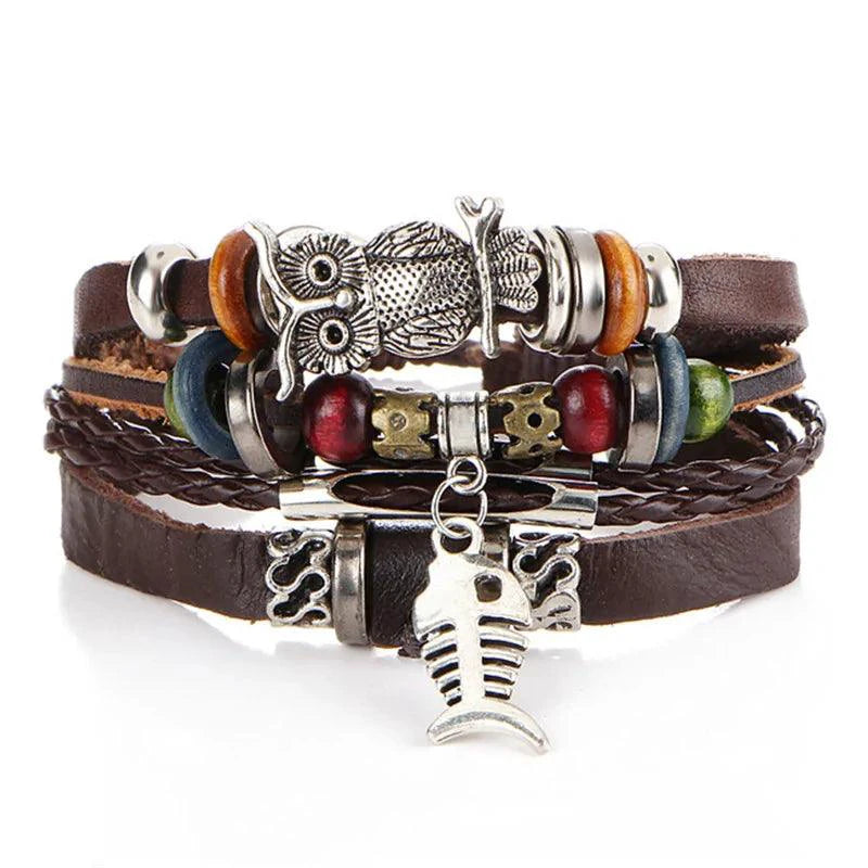 Layered leather charm bracelet by MANDOTOS featuring multiple leather strands and metal charms on a neutral background.