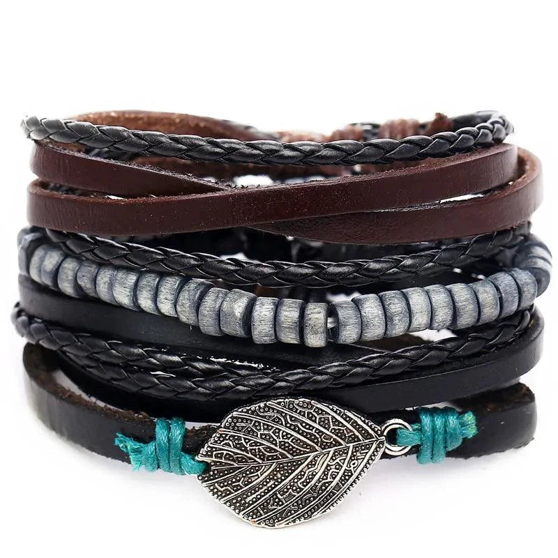 Layered leather charm bracelet by MANDOTOS featuring multiple leather straps and metal charms on a neutral background.