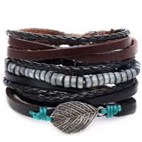 Layered leather charm bracelet by MANDOTOS featuring multiple leather strands and decorative metal charms.
