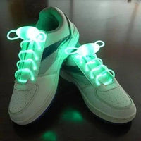 Mandotos LED light-up shoelaces glowing in the dark, vibrant and flexible for stylish, illuminated footwear.