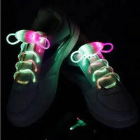 Mandotos LED light-up shoelaces glowing in the dark, colorful and flexible for sports shoes or casual footwear.