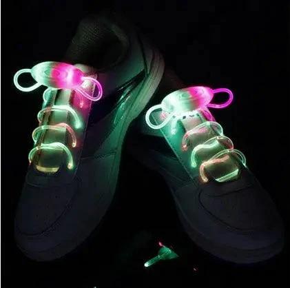 Mandotos LED light-up shoelaces glowing in the dark, colorful and flexible for sports shoes or casual footwear.