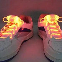 Mandotos LED light-up shoelaces glowing in the dark, colorful glow-in-the-dark shoe laces for sneakers.