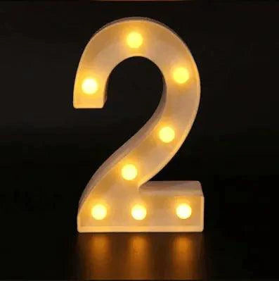 Mandotos luminous letter lights spelling out decorative alphabet characters on a wooden surface.