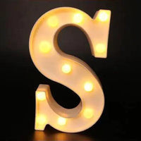 Mandotos luminous letter lights spelling out words, ideal for home decor and ambient lighting with a warm glow.