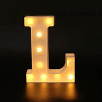 Mandotos luminous letter lights spelling out a word, with warm glow, ideal for decorative home lighting or bedroom decor.