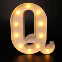 Mandotos luminous letter lights spelling out decorative characters, ideal for room decor and ambient lighting.
