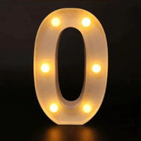 Mandotos luminous letter lights spelling out a word, glowing in warm white, on a dark background for decorative ambient lighting.