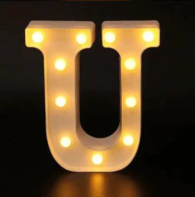 Mandotos luminous letter lights spelling out "LOVE" on a wall, warm glowing decor for home or party ambiance.