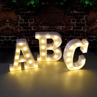 Mandotos luminous letter lights spelling out words, featuring glowing LED letters for decorative home or room lighting.