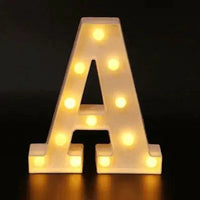 Mandotos luminous letter lights spelling out a word, mounted on a wall with a warm glow, decorative home lighting display.