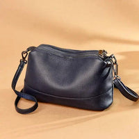 Luxury genuine leather handbag by MANDOTOS featuring sleek design and elegant craftsmanship.