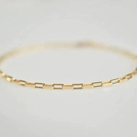 Handcrafted luxury gold chain bracelet by MANDOTOS featuring intricate links and a polished finish.