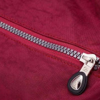 Mandotos luxury women's waterproof Bylon cloth crossbody bag with large capacity, shoulder strap, and tote style.