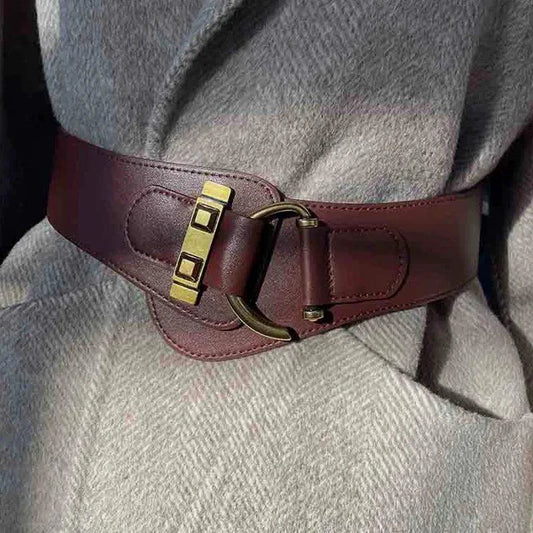 Mandotos designer women's wide burgundy leather waist cummerbund belt with gold buckle and stretch fit.