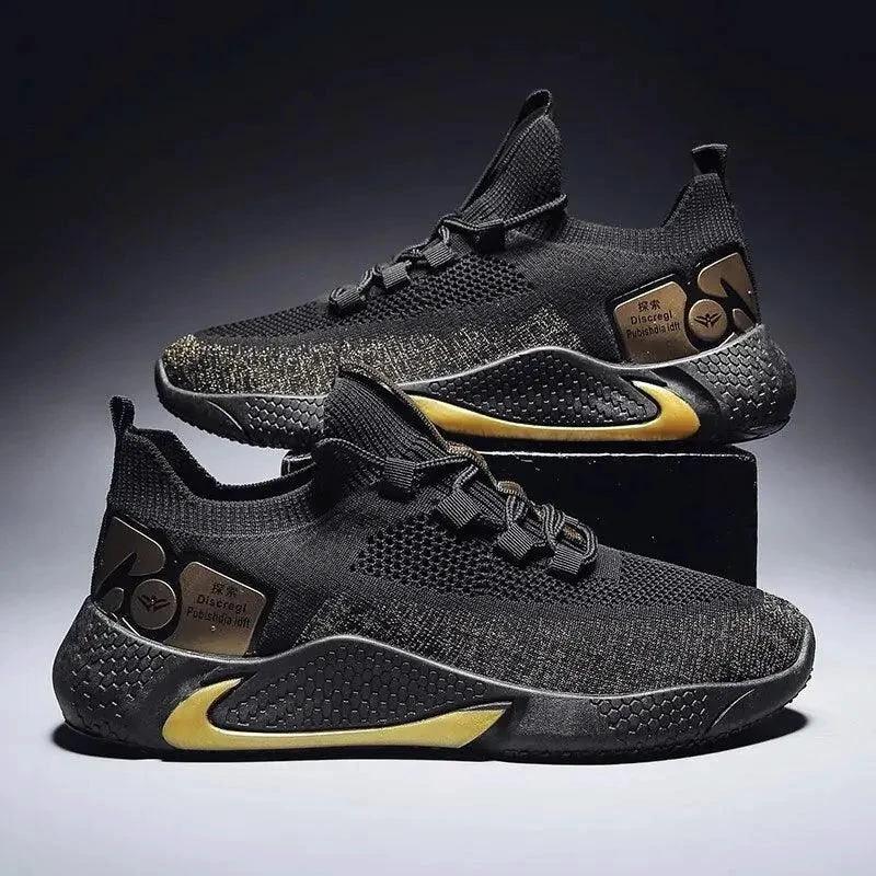 Men's athletic trainer shoes by MANDOTOS in black with white soles, featuring breathable mesh and supportive design for active wear.