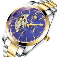 Mandotos men's business mechanical watch with black dial, silver case, and leather strap on a formal wrist.