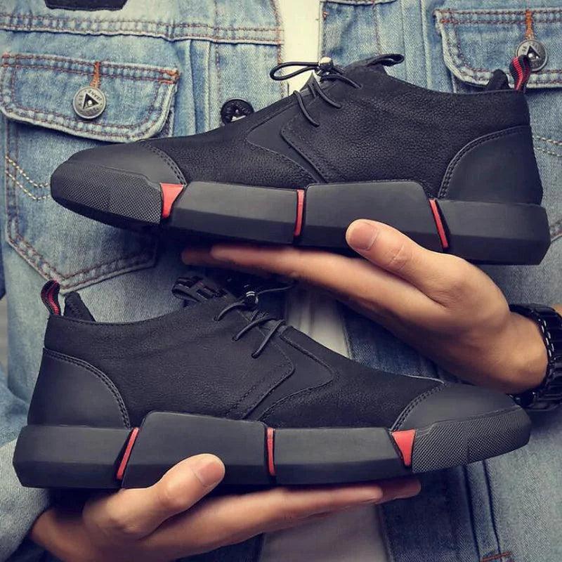 Men's chic leather sneakers by MANDOTOS featuring stylish design and comfortable fit, shown in a close-up front view.