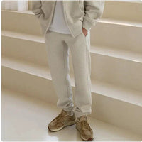Mandotos men's hooded sports sweatshirt in gray, featuring a front pocket and drawstring hood for casual athletic style.