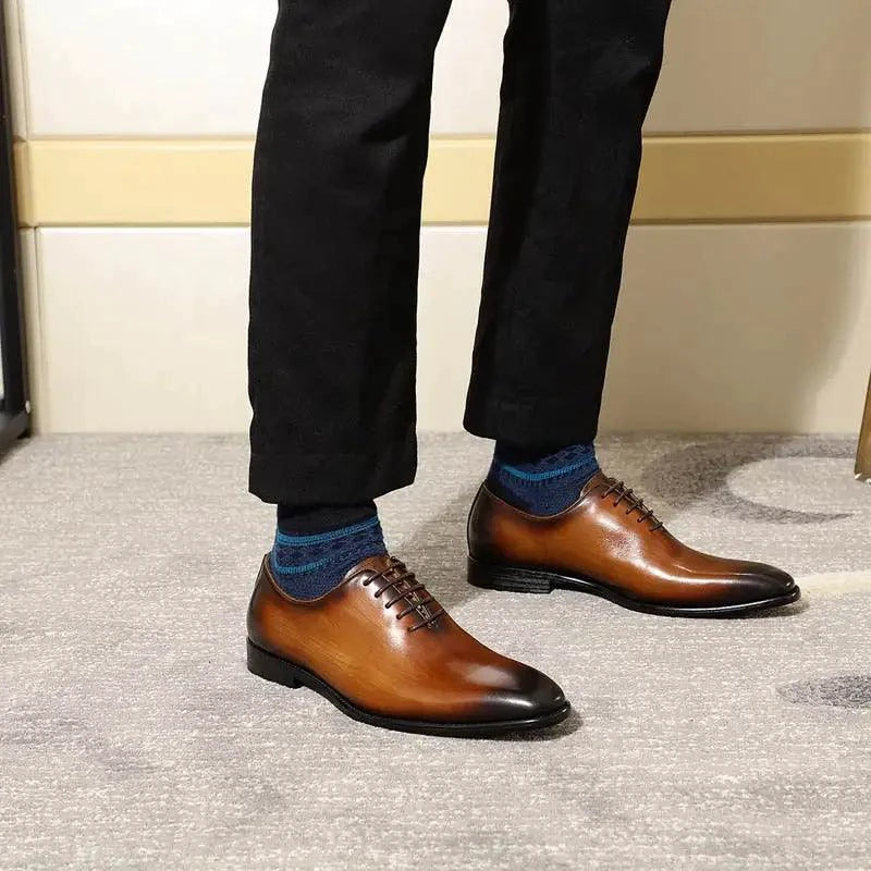 Men's brown leather Oxford shoes by MANDOTOS, featuring sleek design and polished finish for formal occasions.