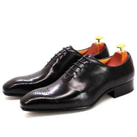 Men's black leather Oxford shoes by MANDOTOS, featuring classic lace-up design and polished finish.