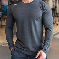 Mandotos men's long sleeve sports fitness shirt, quick-dry badminton and running top, ideal for outdoor training and bodybuilding.