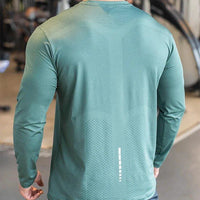 Mandotos men's long sleeve sports fitness shirt, quick-dry badminton and running top, ideal for outdoor training and bodybuilding.