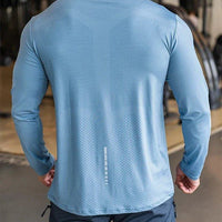 Mandotos men's long sleeve sports fitness shirt for badminton, running, and training, made of quick-dry, lightweight, breathable material.