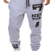Men's MANDOTOS joggers in black with elastic waistband and tapered fit, made of comfortable stretch fabric.