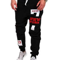 Mandotos men's joggers in black with elastic waistband and cuffed ankles, made from comfortable athletic fabric.