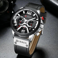 Mandotos military leather chronograph wristwatch with black dial and leather strap, featuring multiple subdials and stainless steel case.