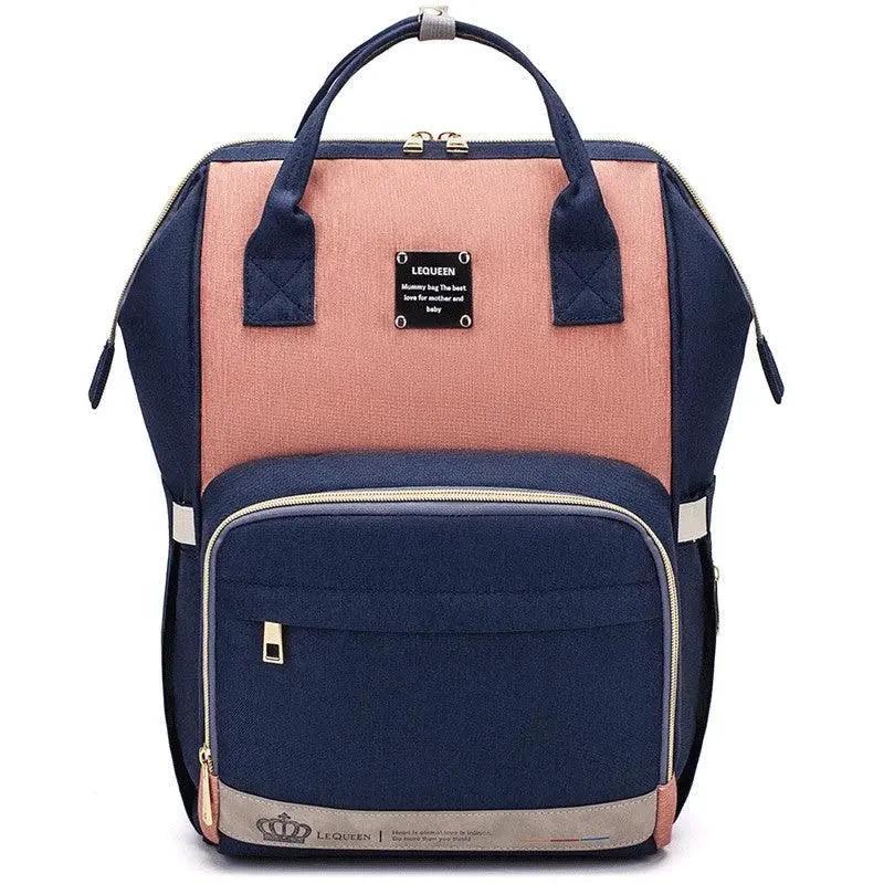 Mandotos Mummy Maternity Bag with multiple compartments and handles, designed for stylish and practical maternity needs.