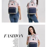 Mandotos Mummy Maternity Bag with multiple compartments and handles, designed for moms to carry baby essentials comfortably.