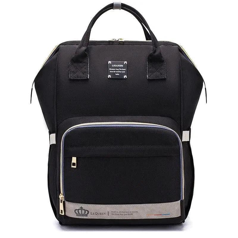 Mandotos Mummy Maternity Bag with multiple compartments, beige fabric, and sturdy handles for stylish pregnancy and postpartum use.