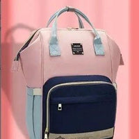 Mandotos Mummy Maternity Bag with multiple compartments and adjustable straps, designed for new mothers and baby essentials.