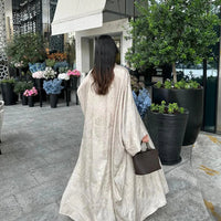Mandotos Muslim robe abaya in black with flowing fabric and elegant design, suitable for modest Islamic attire.