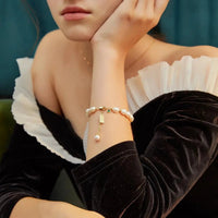 Luxury MANDOTOS natural zircon pearl bracelet featuring elegant white pearls and sparkling zircon accents.