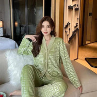 Gold velvet women's pajamas suit by MANDOTOS featuring a comfortable long-sleeve top and matching pants for relaxed sleepwear.