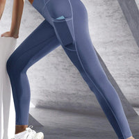 Mandotos high waist women's yoga leggings with pockets, stretchy solid color sportswear pants for fitness and running.