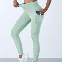 Mandotos high waist women's stretch yoga leggings with pockets, push-up fit, solid color, suitable for fitness, running, and sports activities.