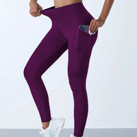 Mandotos high waist women's yoga leggings with pockets, stretch fit, solid color, suitable for fitness, running, and sports activities.