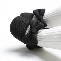 Soft newborn shoes by MANDOTOS, featuring cozy fabric and small, slip-on design perfect for baby’s first steps.