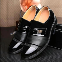 Pair of black patent leather shoes by MANDOTOS, featuring a sleek design with shiny finish and classic style.