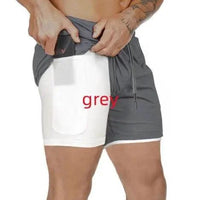 Mandotos Pocket Compression Shorts showing a close-up of black athletic shorts with side pockets for sports and training.