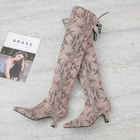 Black pointed over-the-knee high-top fashion boots by MANDOTOS, showcasing sleek design and tall, fitted silhouette.