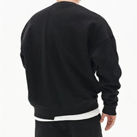 Loose men's pullover round neck sweater by MANDOTOS, showcasing a cozy fit and classic style in neutral fabric.
